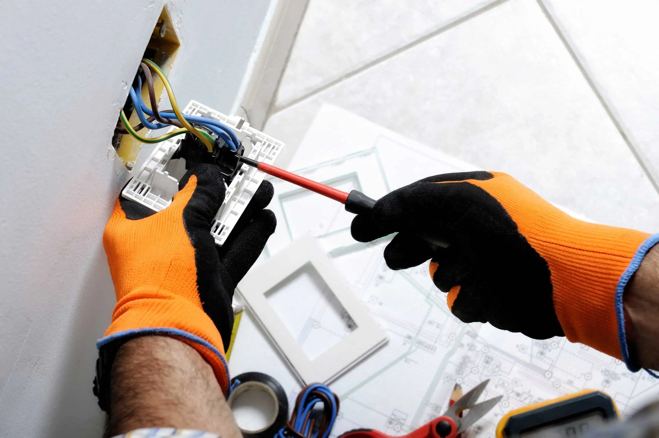 electrician,working,safely,on,switches,and,sockets,of,a,residential